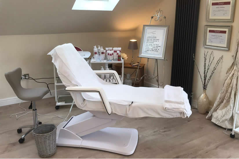 The treatment room, with a heated treatment couch and Guinot products